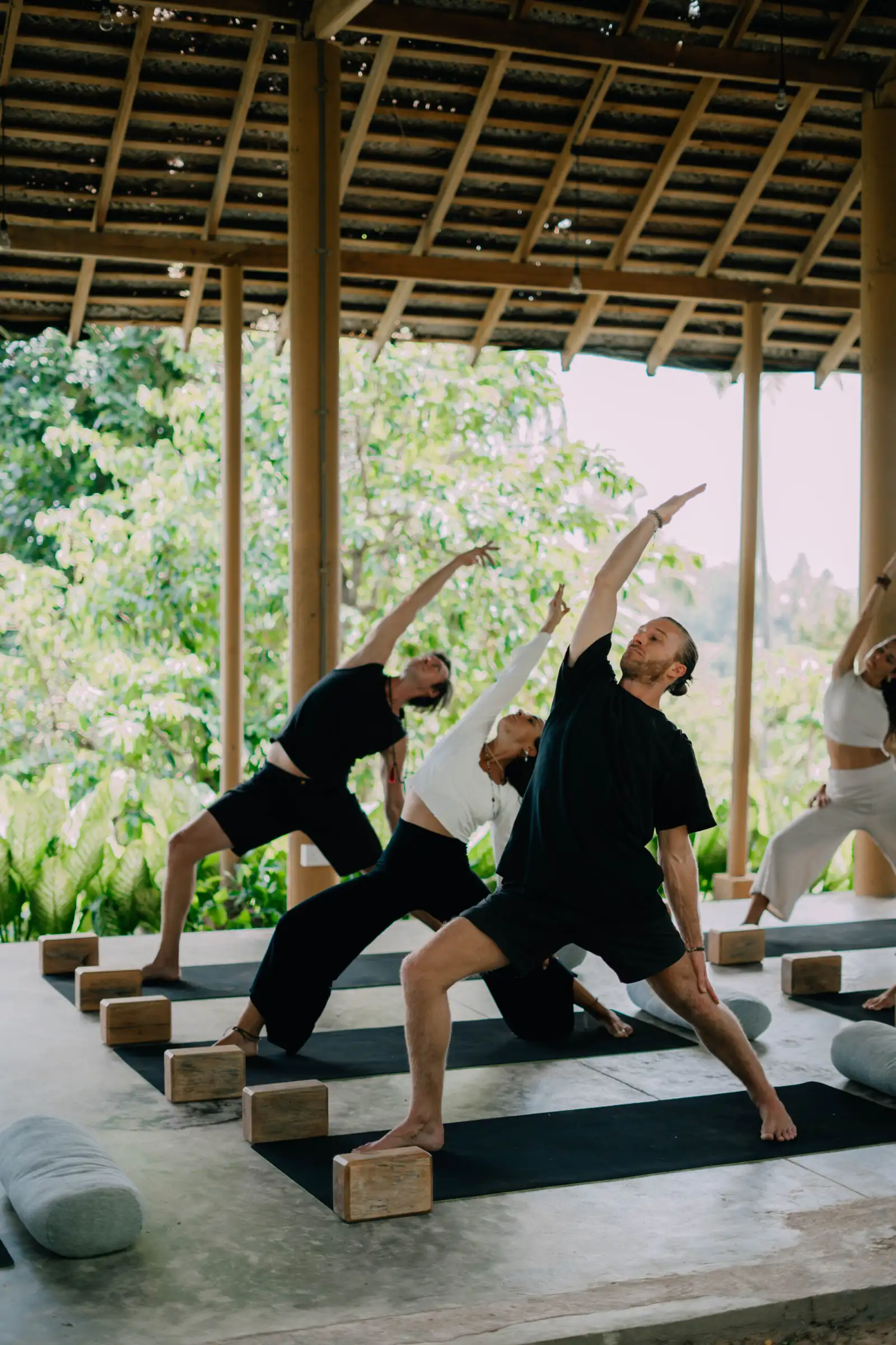 Students practising asana during teacher training at Senses