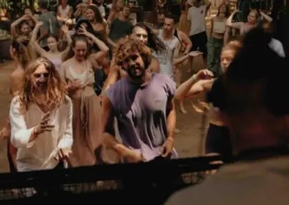 Dancers moving together on the open-air floor at Senses