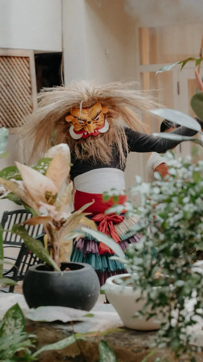 A dancer in a traditional Sri Lankan mask and costume